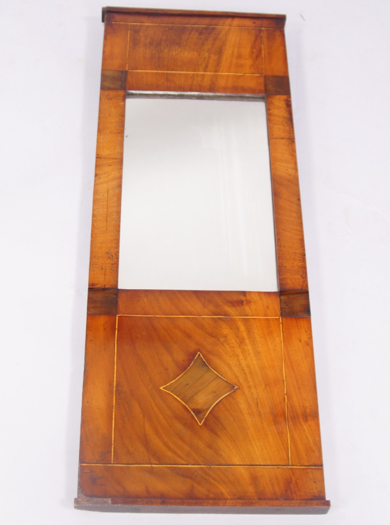 A 19thC mahogany pier glass with string inlaid deep frame