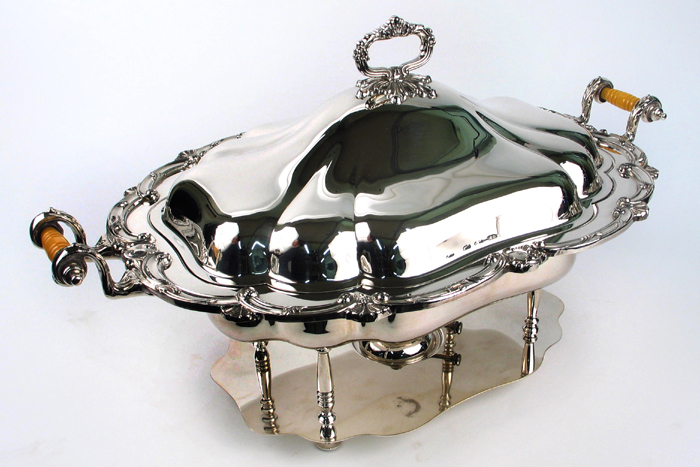 A HOLIDAY SILVERPLATED COVERED WARMING SERVER having a removable inner