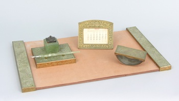 A Carved Hardstone Desk Set Consisting of a blotter with