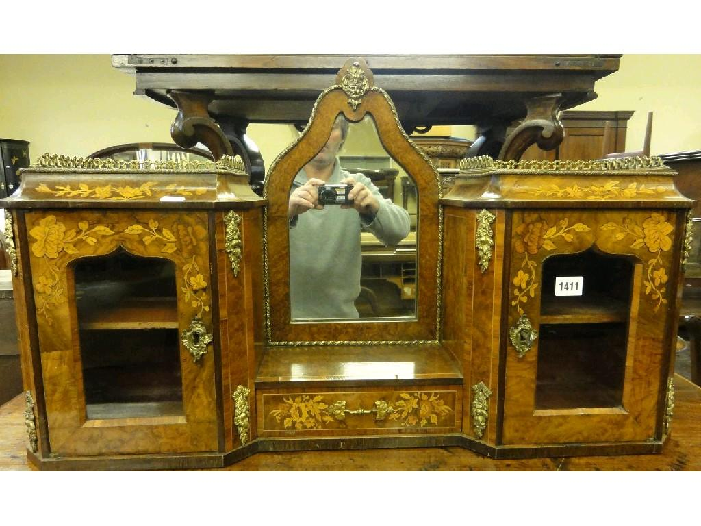 A Victorian figured walnut veneered table cabinet enclosed by a