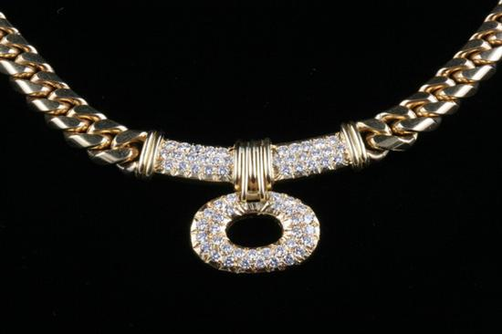 18K YELLOW GOLD AND DIAMOND NECKLACE Graduated flattened curb link