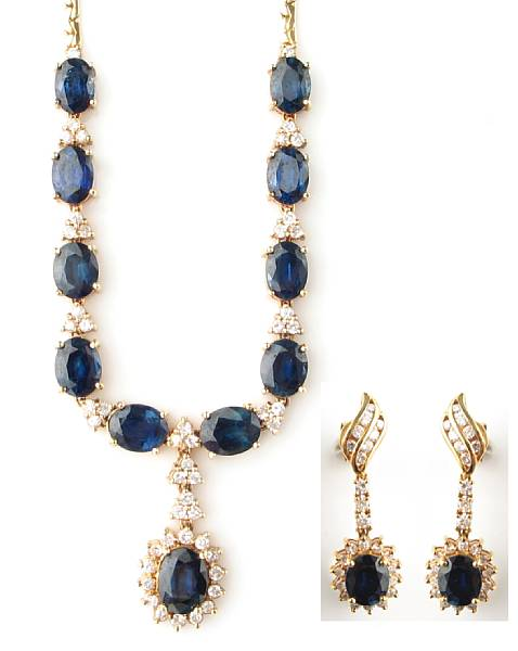 A diamond sapphire and 14 karat yellow gold necklace with