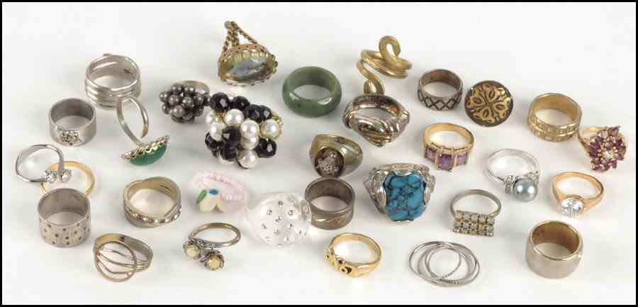 COLLECTION OF RHINESTONE RINGS Together with gilt and plastic rings