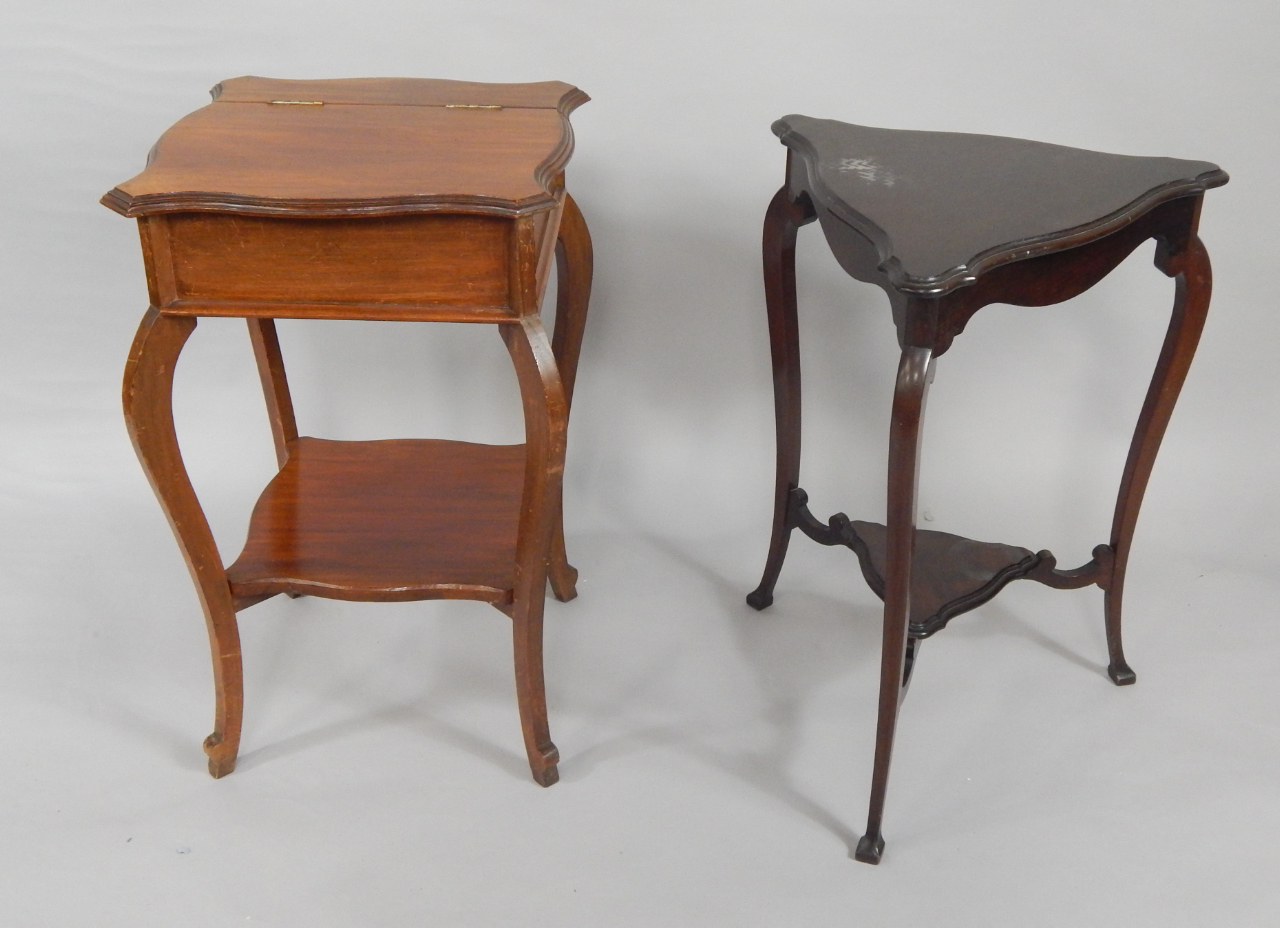 A Victorian mahogany sewing table the serpentine lidded top enclosing