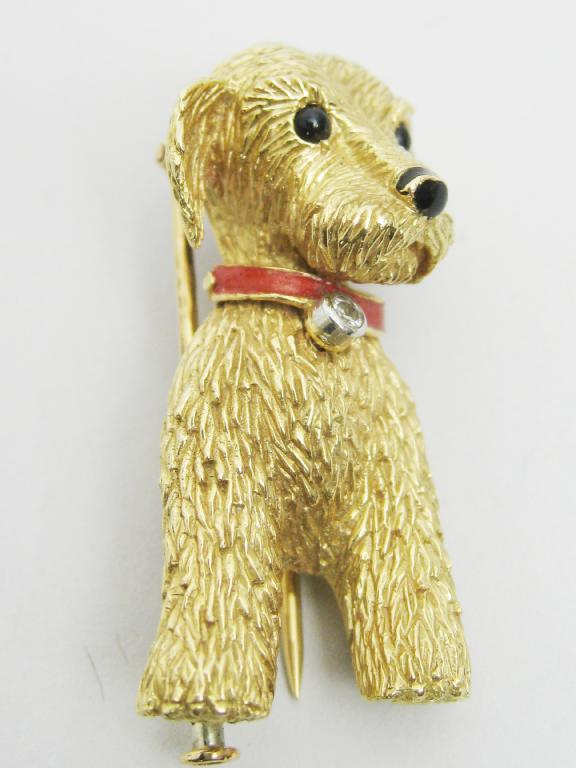 A gold Brooch in the form of a Terrier with