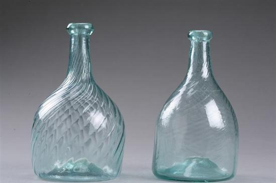 TWO BLOWN GLASS BOTTLES American 19th century Aqua swirled rib