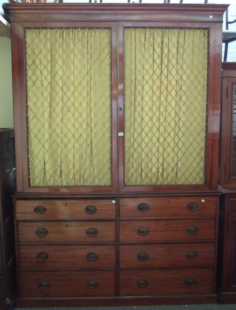 A George III mahogany bookcase the upper section with moulded