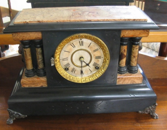 TWO AMERICAN MANTEL CLOCKS One is an ebonized clock with