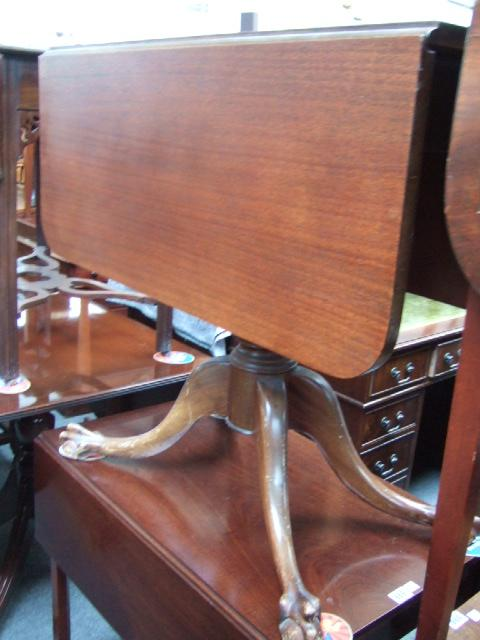 A Regency style mahogany drop flap centre table with a