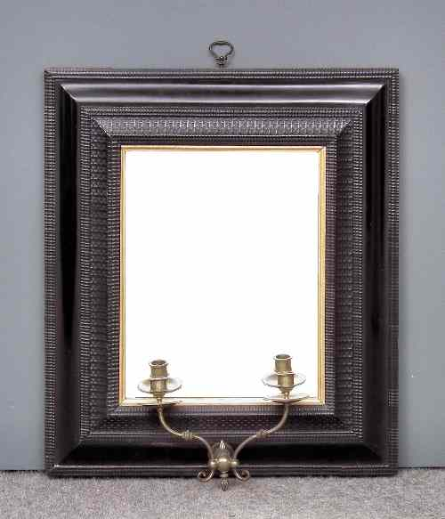 An ebonised and moulded rectangular picture frame later converted to