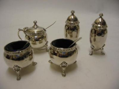 A FIVE PIECE CRUET SET maker Adie Brothers Birmingham 1940