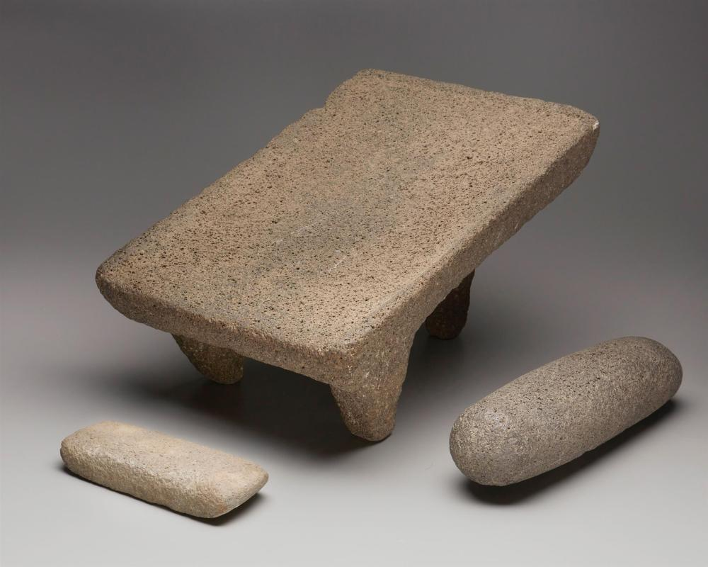 A Mexican mano and metate set 20th Century Comprising a