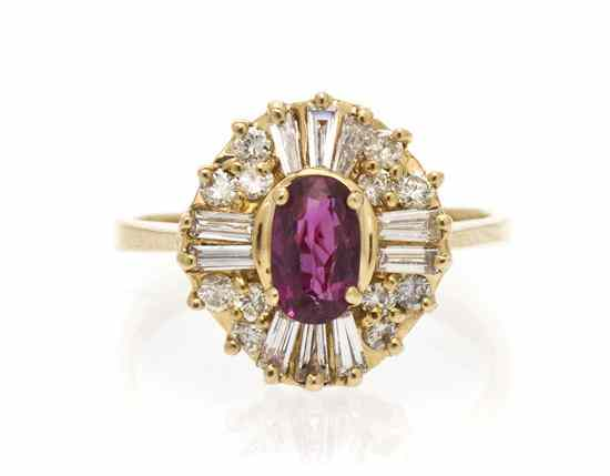 A 14 Karat Yellow Gold Ruby and Diamond Ring containing