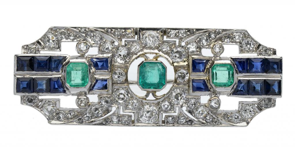 AN EMERALD DIAMOND AND SAPPHIRE BROOCH the plaque of geometric