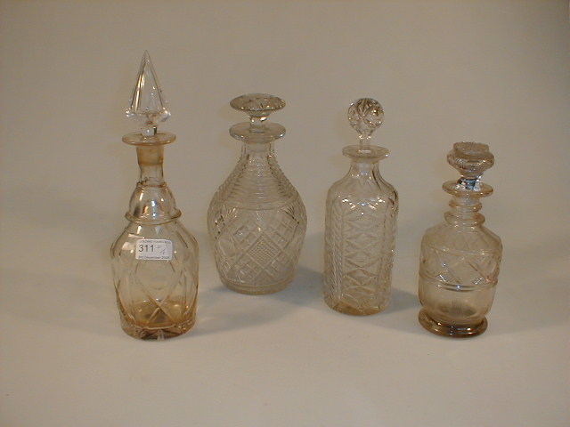 Two Georgian cut glass decanters a slice cut decanter and