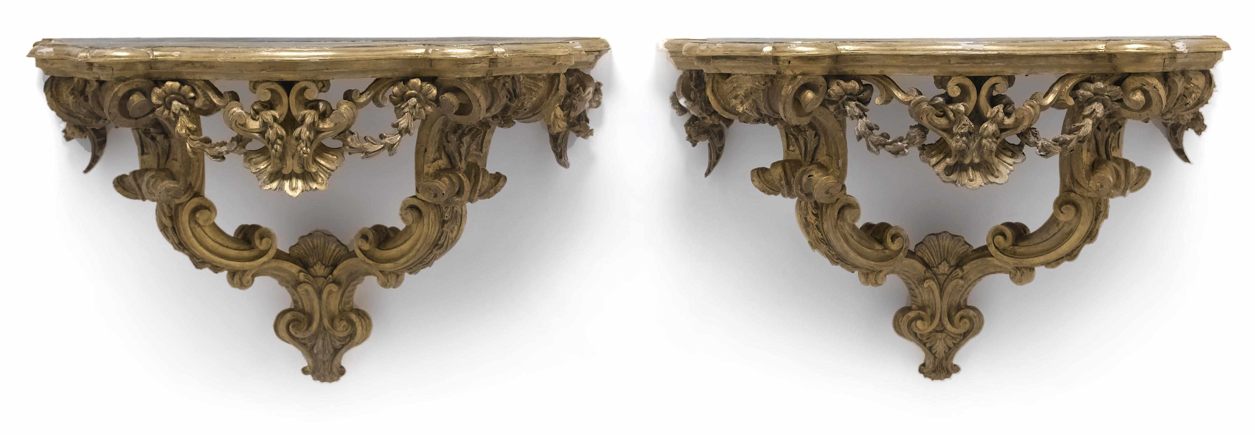 A pair of Italian Rococo carved giltwood consoles mid 18th