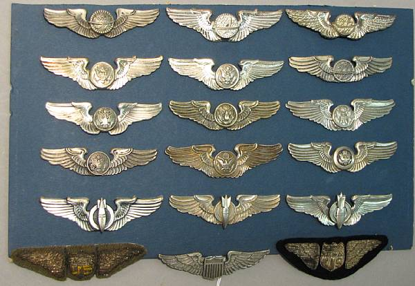 A group of aviator s wings military badges Including three