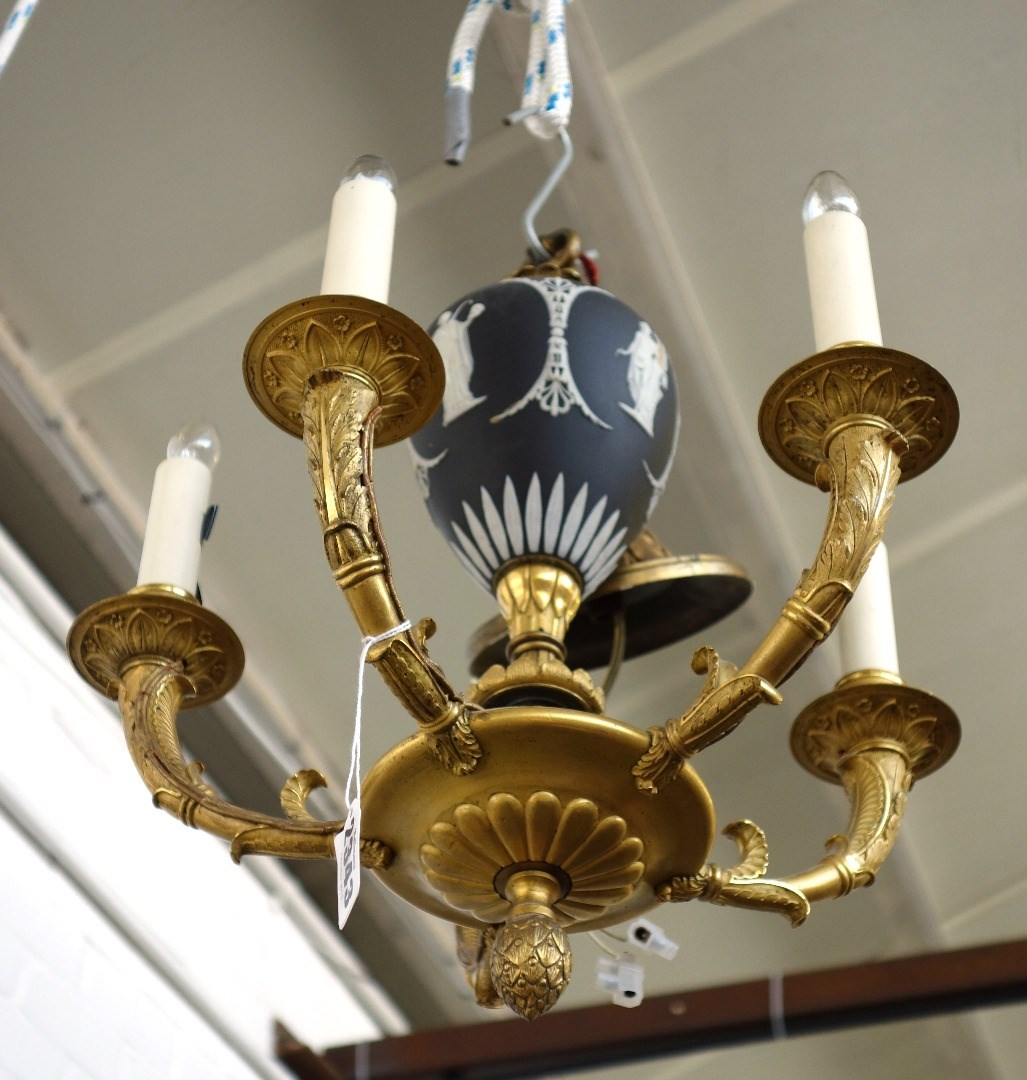 A gilt bronze four branch chandelier early 20th century the
