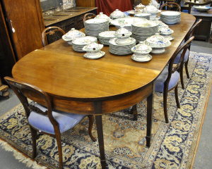A George III mahogany D end dining table comprising a