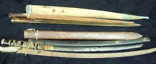 A Japanese sword in a lacquered sheath a machete by