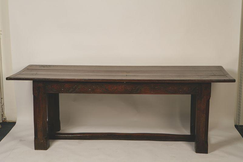 A CHARLES II STYLE OAK REFECTORY TABLE with a plank