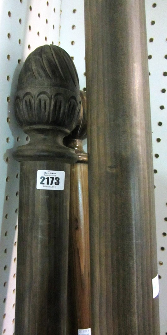 A group of three 20th century stained pine curtain poles