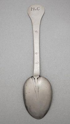 A William III spoon with a rounded terminal scratched MG