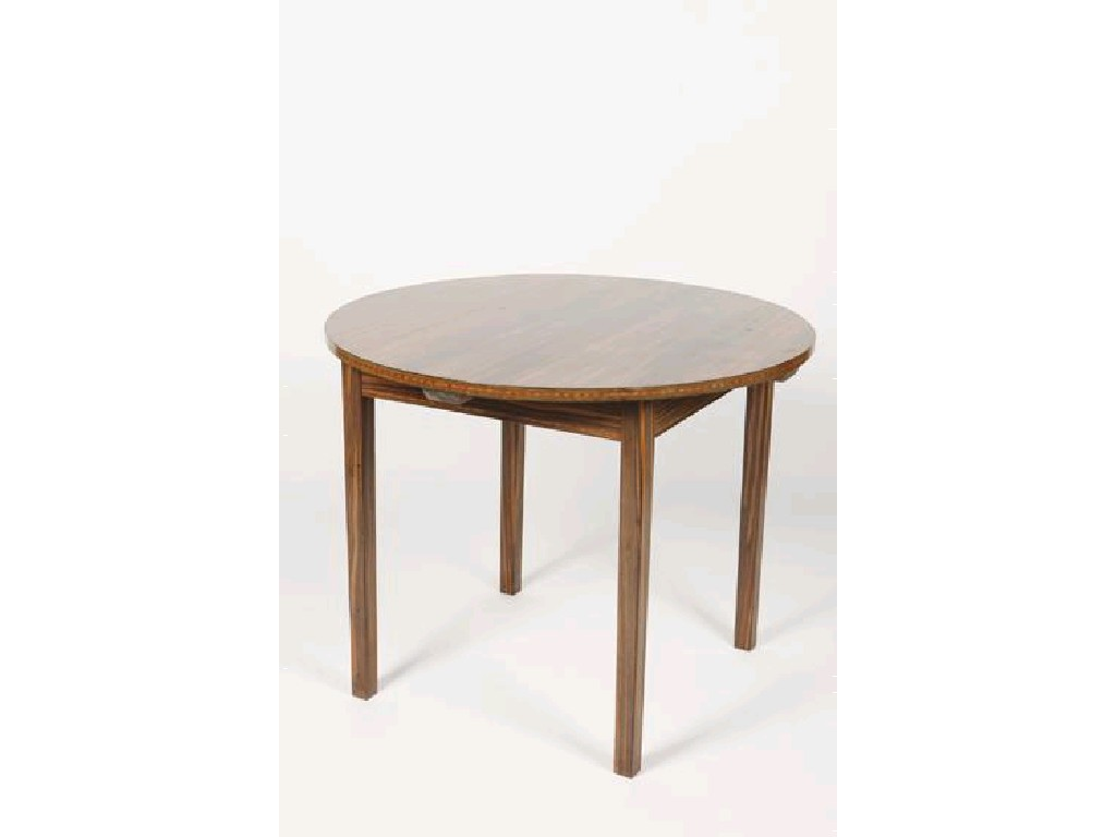ERNEST W GIMSON A CIRCULAR TOPPED MACCASSAR EBONY TABLE the