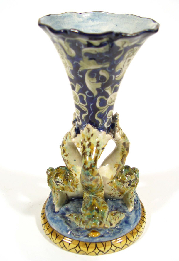 Continental Faience glazed pottery bowl supported by dolphins 23cm high
