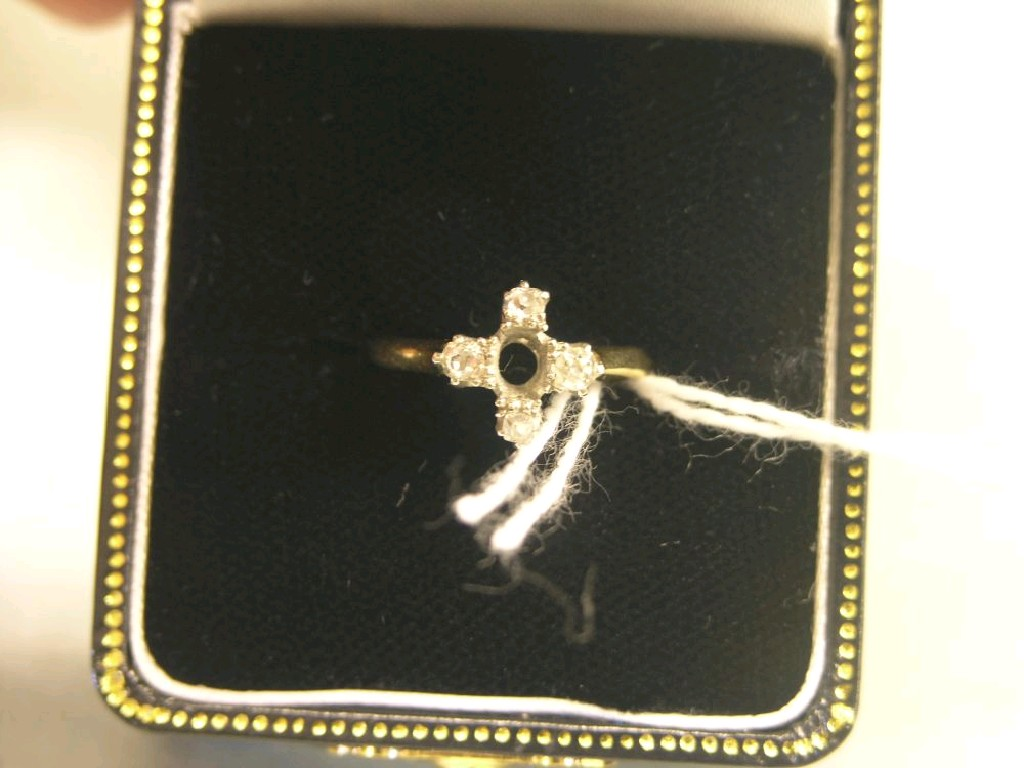 An 18ct gold dress ring set four small diamonds principal