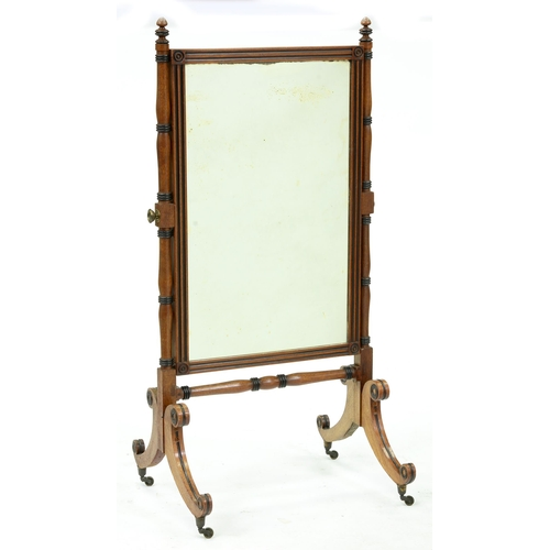 A George IV mahogany and ebonised cheval mirror the fluted