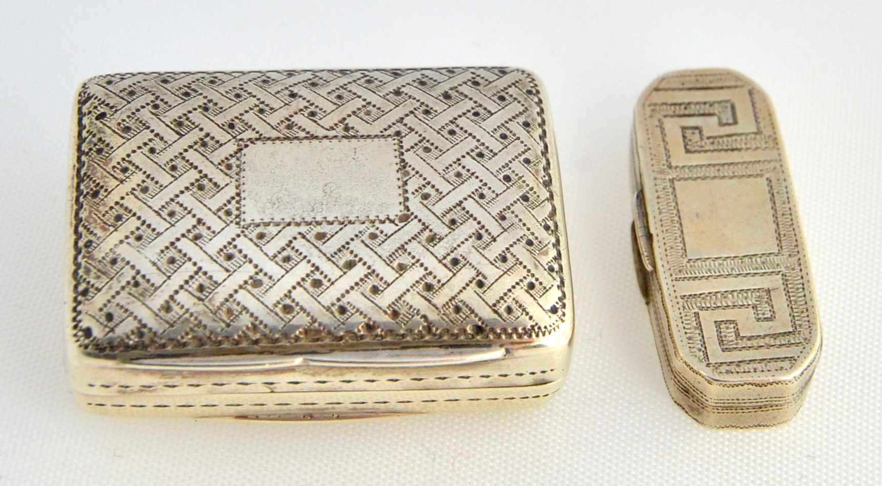 A silver rectangular vinaigrette with a floral and scroll pierced
