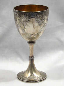 An English hallmarked silver goblet finely engraved dated 1863 14cm