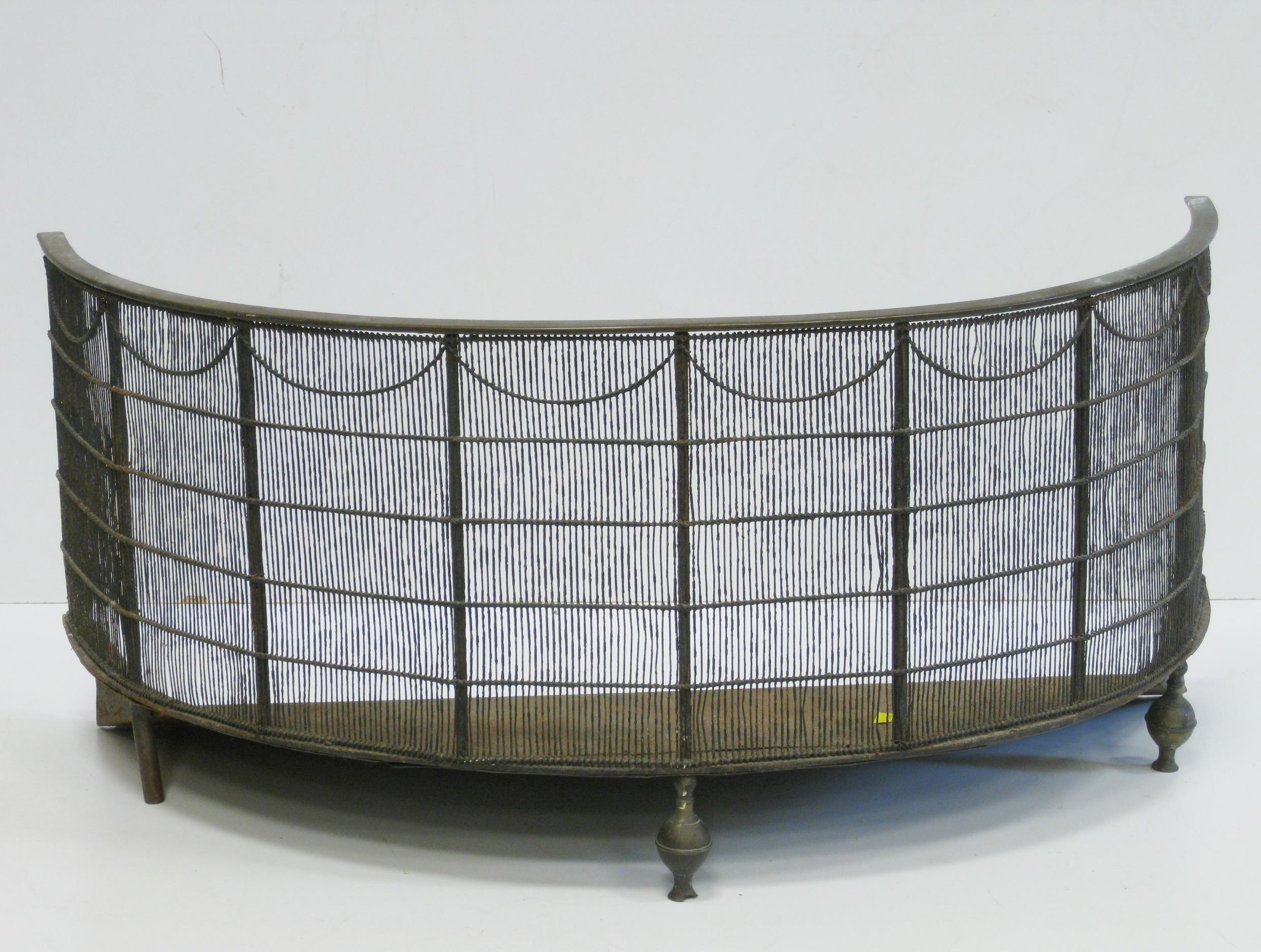 An early 19th Century brass mounted bow front wirework Fender