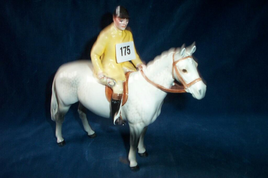 A Beswick model of a huntsman with yellow over painted