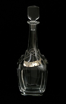 An Orrefors Crystal Decanter with Three Sterling Silver Labels Panel