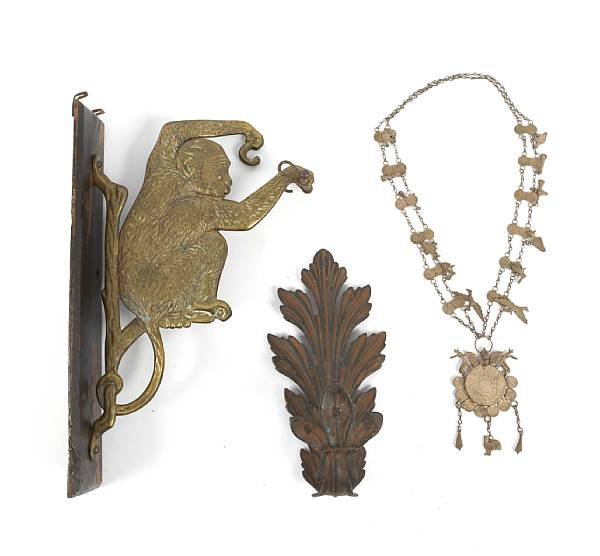 A large grouping of architectural metal furnishings comprising coat hooks