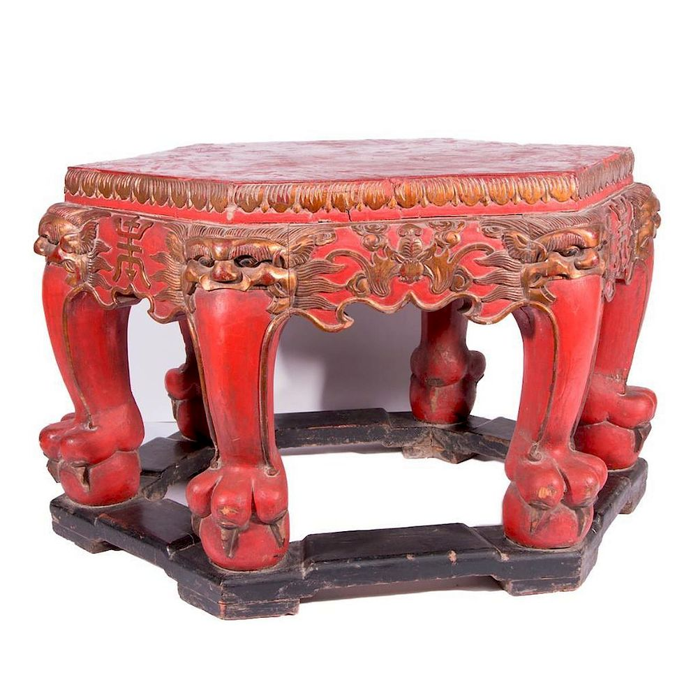 A 19th century red lacquered Chinese table A finely carved