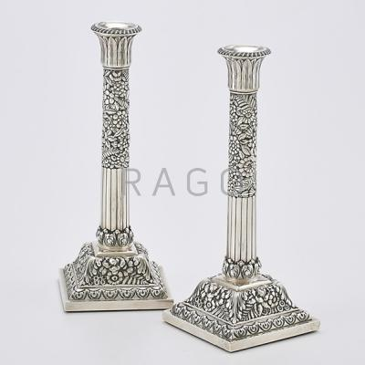 TIFFANY CO STERLING REPOUSSE CANDLESTICKS Half reeded and floral columns