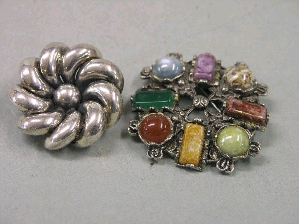 A Scottish hardstone brooch set eight coloured stones and a