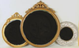 Three Decorative Mirrors Three decorative mirrors a Renaissance style repousse