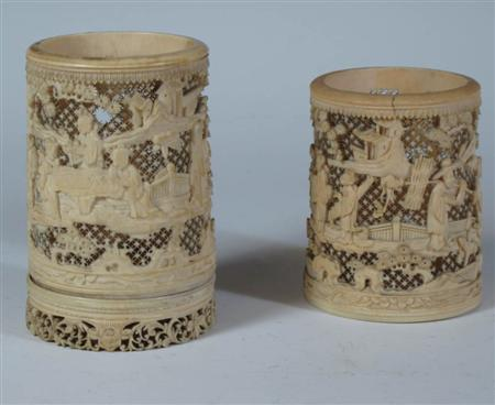Two similar carved and pierced ivory tusk vases Meiji period