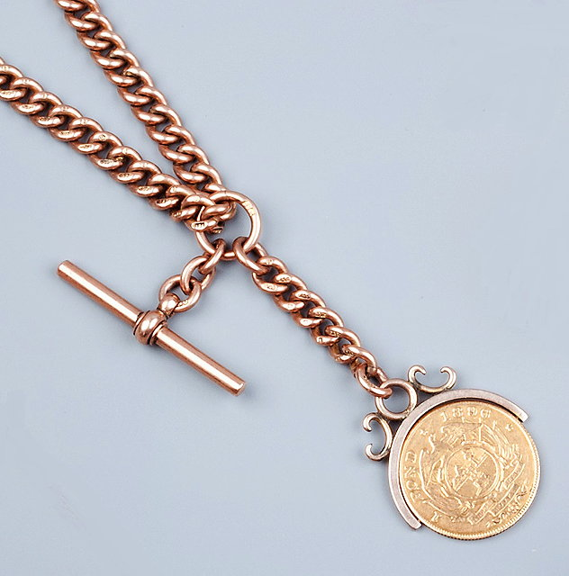 A 9CT GOLD ALBERT CHAIN composed of uniform curb links