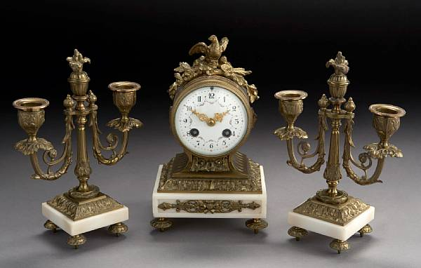 A Louis XVI style gilt bronze mounted white marble clock
