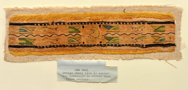 A GALLOON OR ARM BAND decorated with four antelope and