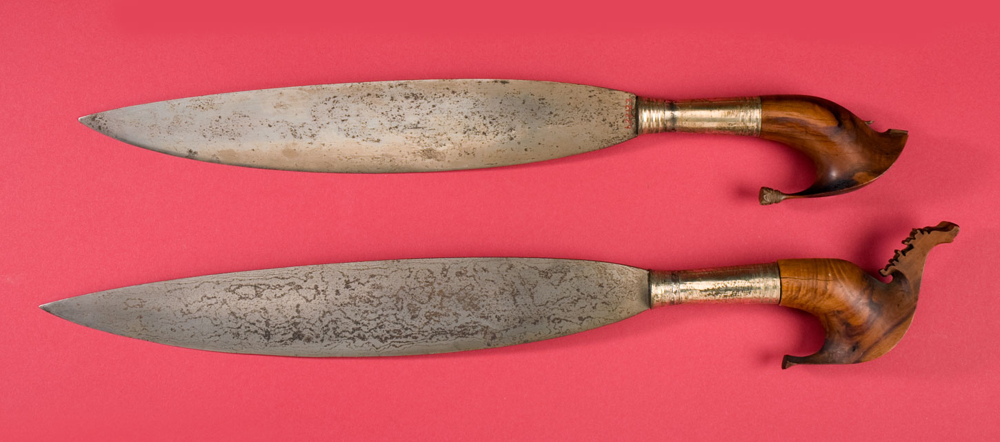 TWO LATE NINETEENTH CENTURY MORO BARONGS Each with carved burl