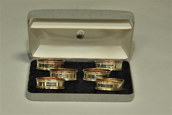 SIX ENGLISH STERLING SILVER NAPKIN RINGS IN CASE Oval rings
