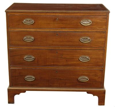 An early 19th century mahogany chest the crossbanded and reeded
