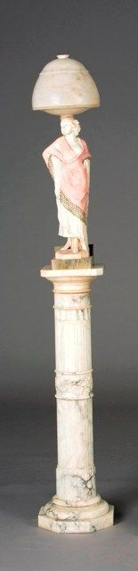 An Art Deco alabaster figural lamp on a marble pedestal