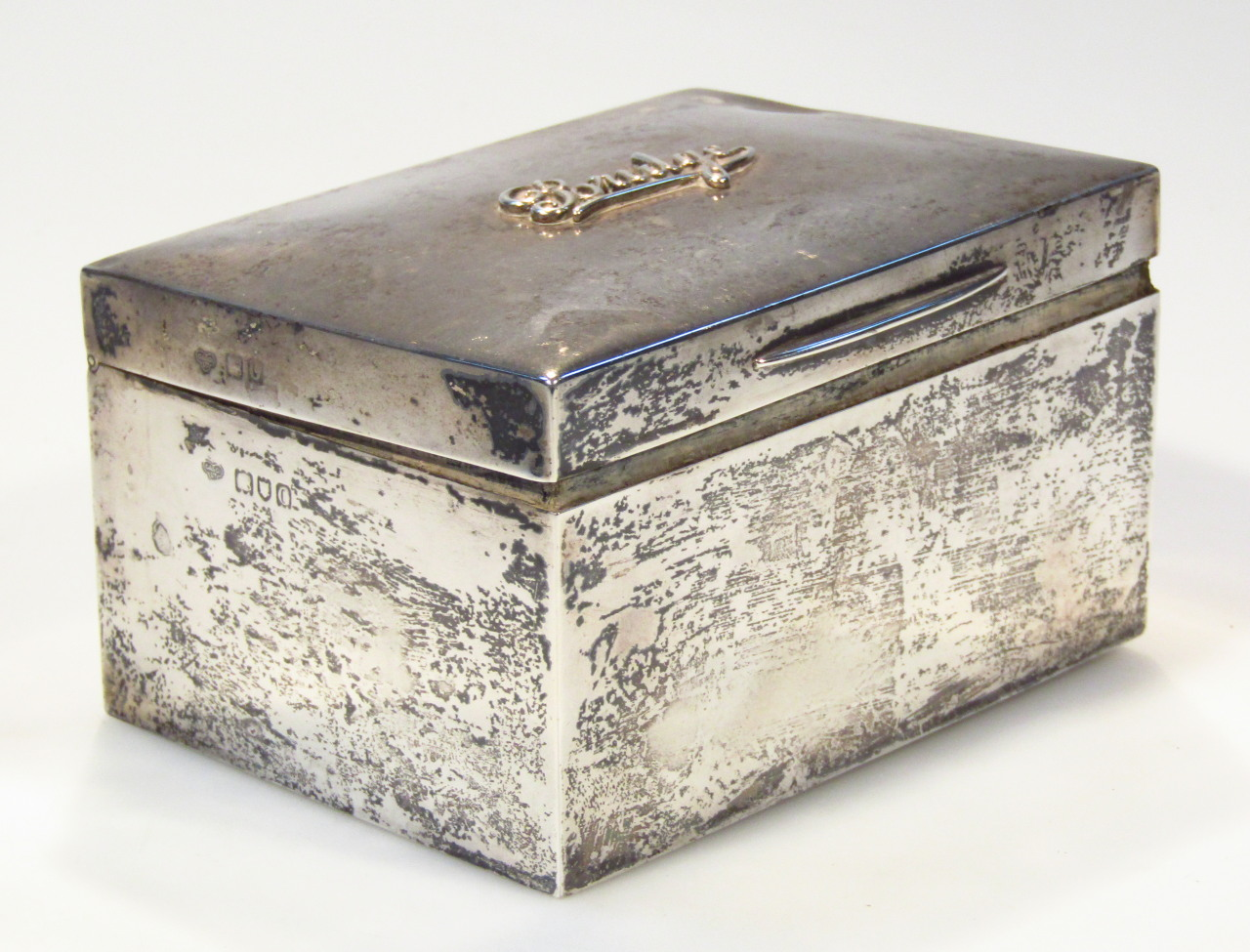 An Edwardian silver bridge box of plain rectangular outline the
